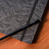 A Blackwing Artist Series Slate Notebook with Florian Bertmer's art - grey and black notebook with all black pencil